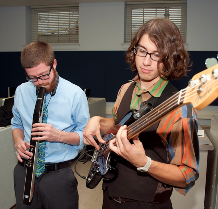 Students playing digital instruments